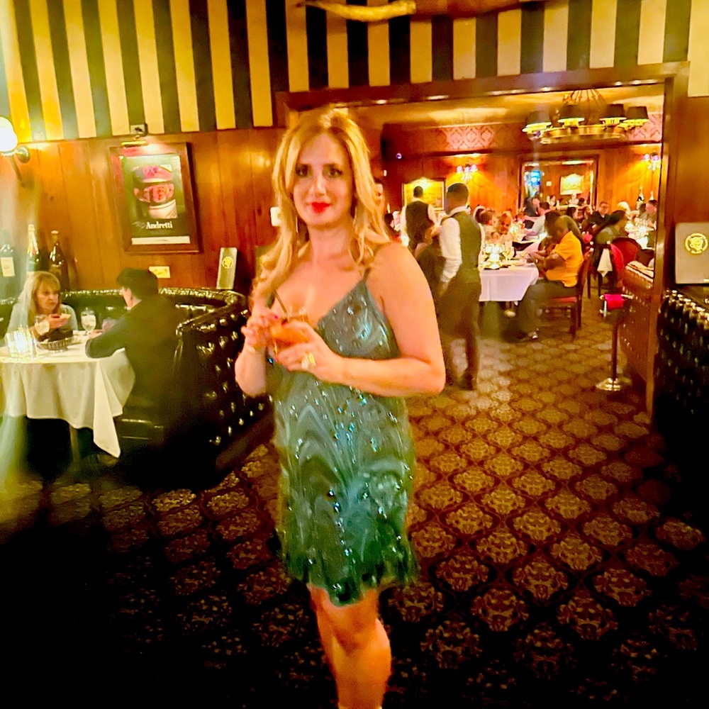 Plunging green sequin dress.